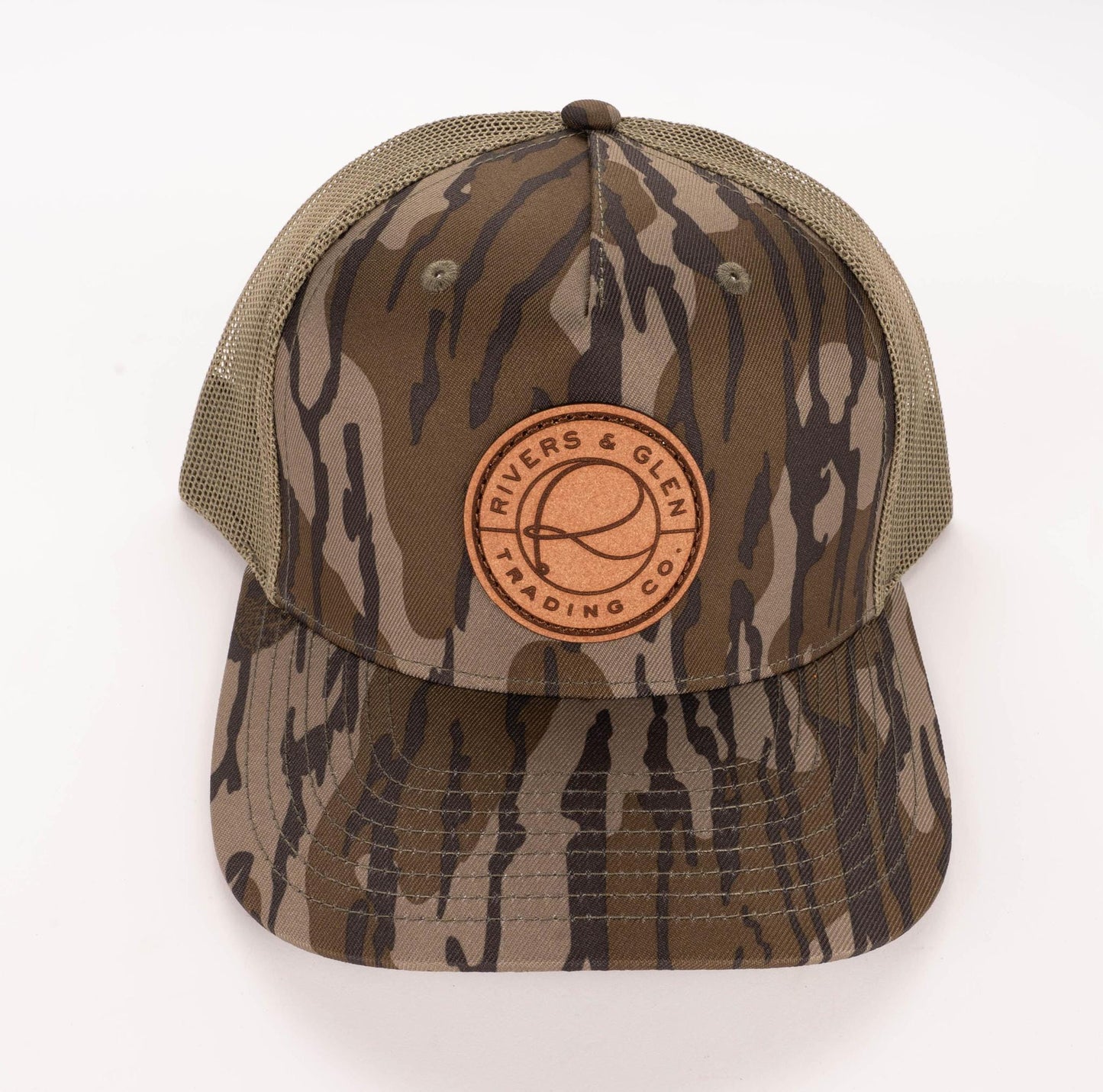 R&G Badge Camo Trucker (Mossy Oak Loden) Rivers and Glen Trading Co. Hats LP Mossy Oak Bottomland/Loden Headwear Rivers and Glen Trading Co